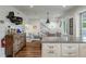 Open-concept space with dining area, seating, and staircase at 3405 Cameron Blvd, Isle of Palms, SC 29451