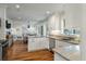 Open-concept living space with granite counters, stainless appliances, and open dining area at 3405 Cameron Blvd, Isle of Palms, SC 29451