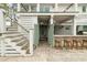 Charming outdoor bar area with an outdoor shower and staircase leading to the upper level at 3405 Cameron Blvd, Isle of Palms, SC 29451