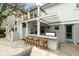 Great outdoor bar area with grill, seating and outdoor shower adjacent to the main house at 3405 Cameron Blvd, Isle of Palms, SC 29451