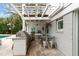 Well-equipped outdoor kitchen featuring a grill, sink, and dining area, perfect for entertaining at 3405 Cameron Blvd, Isle of Palms, SC 29451