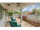 Covered back patio with rocking chairs, ceiling fans, and a view of the well-maintained backyard at 3405 Cameron Blvd, Isle of Palms, SC 29451
