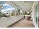 Relaxing porch with cushioned seating and scenic views through large windows at 3405 Cameron Blvd, Isle of Palms, SC 29451