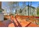 View of the wood back deck with stairs and a railing overlooking the yard and surrounding trees at 3447 Toomer Kiln Cir, Mount Pleasant, SC 29466