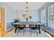 Dining room featuring a wood table, modern chairs, decor wall hangings, and natural light from the window at 3447 Toomer Kiln Cir, Mount Pleasant, SC 29466
