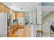 Open kitchen with stainless steel appliances, wooden cabinets, and view of the living space at 3447 Toomer Kiln Cir, Mount Pleasant, SC 29466