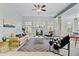 Inviting living room featuring a fireplace, plush sofa, and stylish decor with natural light at 3447 Toomer Kiln Cir, Mount Pleasant, SC 29466