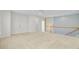 Open living area featuring neutral decor and a staircase with a wooden railing at 3447 Toomer Kiln Cir, Mount Pleasant, SC 29466