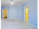 Bright main bedroom with neutral carpet, a ceiling fan, and doorway to a secondary room at 3447 Toomer Kiln Cir, Mount Pleasant, SC 29466