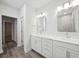 Bright bathroom featuring dual sinks, marble countertops, and modern fixtures at 349 Wappoo Trace Ln, Summerville, SC 29486