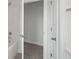 Bathroom featuring an open door to a closet area with carpet and a shower/tub combo at 349 Wappoo Trace Ln, Summerville, SC 29486
