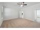 Neutral bedroom with carpet flooring, ceiling fan, and ensuite bathroom at 349 Wappoo Trace Ln, Summerville, SC 29486