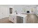 Well-designed kitchen featuring a large island, farmhouse sink, stainless steel dishwasher and open-concept living space at 349 Wappoo Trace Ln, Summerville, SC 29486