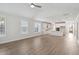 Spacious living room with wood flooring, windows, and a view to the kitchen at 349 Wappoo Trace Ln, Summerville, SC 29486