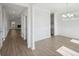 Spacious living room featuring beautiful floors, elegant trim, and a cozy fireplace at 349 Wappoo Trace Ln, Summerville, SC 29486