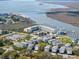 An aerial view of the condo community close to the ocean and its private boat docks at 3701 Dock Site Rd # 302, Edisto Beach, SC 29438