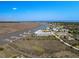 An aerial view of the condo complex and boat docks along the waterway and coastal landscape at 3701 Dock Site Rd # 302, Edisto Beach, SC 29438