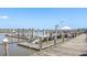 A boat dock featuring slips, pilings, and a ramp, providing access to waterway adventures at 3701 Dock Site Rd # 302, Edisto Beach, SC 29438
