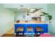 Bright kitchen featuring a breakfast bar with wicker stools and stylish decor at 3701 Dock Site Rd # 302, Edisto Beach, SC 29438