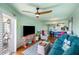 Open-concept living room with kitchen view, modern decor, and access to outdoor balcony at 3701 Dock Site Rd # 302, Edisto Beach, SC 29438
