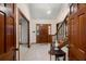 Spacious foyer showcasing tiled flooring, a staircase, and elegant lighting at 4322 Bream Rd, North Charleston, SC 29418