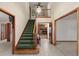 Inviting foyer featuring a staircase, chandelier, and access to other rooms at 4322 Bream Rd, North Charleston, SC 29418