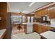 Traditional eat-in kitchen featuring a stainless refrigerator, tile countertops, and wood cabinetry at 4322 Bream Rd, North Charleston, SC 29418