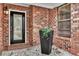Covered entryway with brick accents, elegant door, and tasteful decor creates a warm welcome at 462 Mount Royall Dr, Mount Pleasant, SC 29464