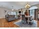 Open-concept living space with fireplace, seamlessly connecting the dining area for easy entertaining at 462 Mount Royall Dr, Mount Pleasant, SC 29464