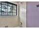 Shower with an adjustable head, neutral tile, and a window looking out onto a yard with a house across the street at 462 Mount Royall Dr, Mount Pleasant, SC 29464