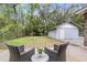 Private backyard boasts a detached garage, and a cozy patio area for outdoor relaxation at 4757 June St, North Charleston, SC 29405
