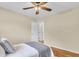 This cozy bedroom features a ceiling fan, plush carpet, and plenty of natural light at 4757 June St, North Charleston, SC 29405