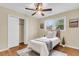 This cozy bedroom features a ceiling fan, plush carpet, and plenty of natural light from the large window at 4757 June St, North Charleston, SC 29405