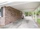 Covered carport of a brick house, offering ample parking space at 4757 June St, North Charleston, SC 29405