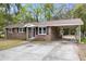 Charming brick home featuring a convenient carport and inviting front entrance at 4757 June St, North Charleston, SC 29405