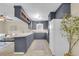 Spacious kitchen with ample cabinet space, neutral walls, and an open view into the living room at 4757 June St, North Charleston, SC 29405