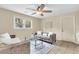 Inviting living room with a ceiling fan, neutral walls, and cozy seating arrangement with natural light at 4757 June St, North Charleston, SC 29405