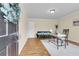 Bright living room features a work space, a comfortable couch, and well-maintained hardwood floors at 4757 June St, North Charleston, SC 29405