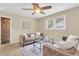 Comfortable living room with neutral walls, an area rug, and a large window with natural light at 4757 June St, North Charleston, SC 29405