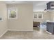 Bright room with tile floors and a window, seamlessly connecting to the kitchen and living areas at 4757 June St, North Charleston, SC 29405