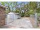 Side view of a backyard shed with a chain link fence at 4757 June St, North Charleston, SC 29405