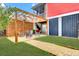 A beautifully landscaped backyard with a pergola-covered seating area, perfect for outdoor gatherings and relaxation at 490 Sanders Farm Ln, Charleston, SC 29492