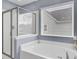 Relaxing bathroom showcasing a soaking tub and a separate glass-enclosed shower at 490 Sanders Farm Ln, Charleston, SC 29492