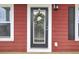 Welcoming front door with glass panel, surrounded by sidelights, wreath, and light fixture at 490 Sanders Farm Ln, Charleston, SC 29492