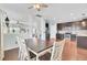 The view of the open concept kitchen, dining area, and stairs from the dining table at 490 Sanders Farm Ln, Charleston, SC 29492