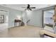 Comfortable living room featuring plush carpeting, a ceiling fan, and neutral walls for versatile décor at 490 Sanders Farm Ln, Charleston, SC 29492