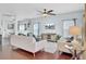 Bright living room with hardwood floors, ceiling fan, media center, and comfortable furniture at 490 Sanders Farm Ln, Charleston, SC 29492