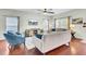 Cozy living area showcasing hardwood floors, comfortable seating, a ceiling fan, and a TV console at 490 Sanders Farm Ln, Charleston, SC 29492
