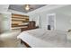 Spacious main bedroom has neutral carpet, tray ceiling, and unique accent wall at 490 Sanders Farm Ln, Charleston, SC 29492