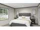 Cozy bedroom with a large window, a comfortable bed, and neutral decor at 525 Railed Ridge Way, Moncks Corner, SC 29461